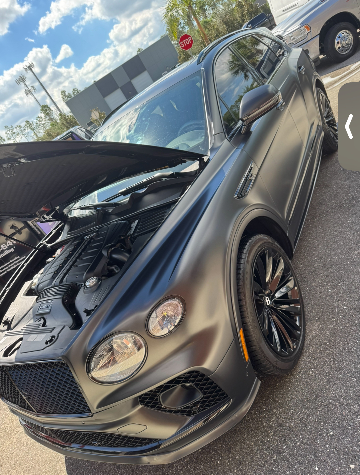 Matte gray Bentley exterior detailing - front quarter view
