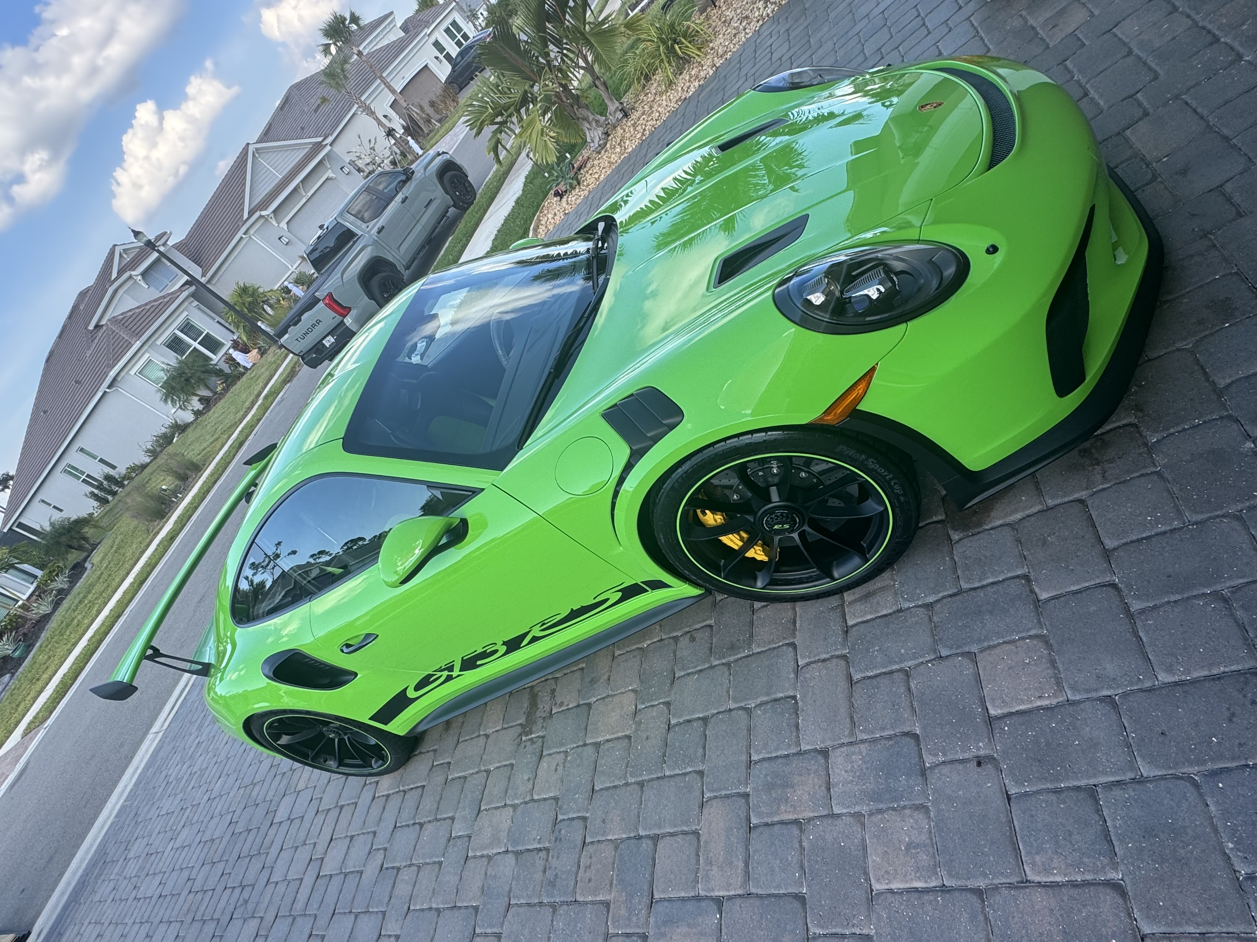 Lime green Porsche GT3 RS exterior detailing - top view showing aerodynamics
