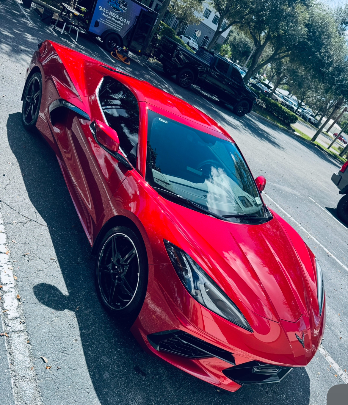 Red Corvette C8 exterior detailing - top view with Flawless Finish trailer